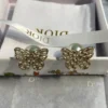 Dior hollow butterfly shape earrings