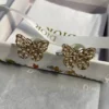 Dior hollow butterfly shape earrings