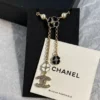 Chanel black and white four-leaf clover enamel necklace