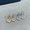Chopard paved heart earrings