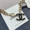 Chanel 2022 Black & White Enamel Gold Plated Logo Belt