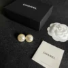 Chanel pearl button stud earrings , White
