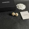 Chanel pearl button stud earrings , White