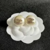 Chanel pearl button stud earrings , White