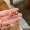 Chanel resin button stud earrings , black ,red