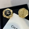 Chanel camellia button stud earrings , Black & Golden