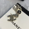 Chanel camellia stud earrings , Black