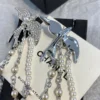 CHANEL Spring-Summer 2025 Bird Pendant Earrings Clutch with chain