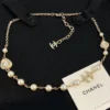 Chanel Brushed Threaded Button Pearl Necklace