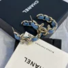 CHANEL Hoop earrings – Metal & denim, gold & blue