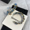 CHANEL Hoop earrings – Metal & denim, gold & blue
