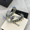 CHANEL Hoop earrings – Metal & denim, gold & blue