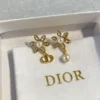 Dior Bloom in  Earrings Gold-Finish Metal with White Resin Pearls and Silver-Tone Crystals