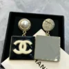 CHANEL Metal Resin Pearl CC Drop Earrings Gold Black White