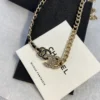 Chanel 2023 Srass & Leather CC Choker – Black, Gold