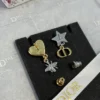 Dior Petit CD Lucky Charms Earrings Gold-Finish Metal and White Resin Pearls