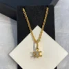 Triomphe Solitaire Sparkle Necklace in Strass and Brass with Gold Finish