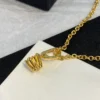 Triomphe Solitaire Sparkle Necklace in Strass and Brass with Gold Finish