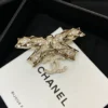 Chanel Brooch Coco Mark Ribbon Motif Golden Gold-plated