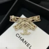 Chanel Brooch Coco Mark Ribbon Motif Golden Gold-plated