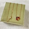 Lucky Spring pendant, open wings ladybug