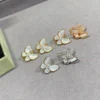 Two Butterfly earrings ,18K rose gold, Diamond, Mother-of-pearl