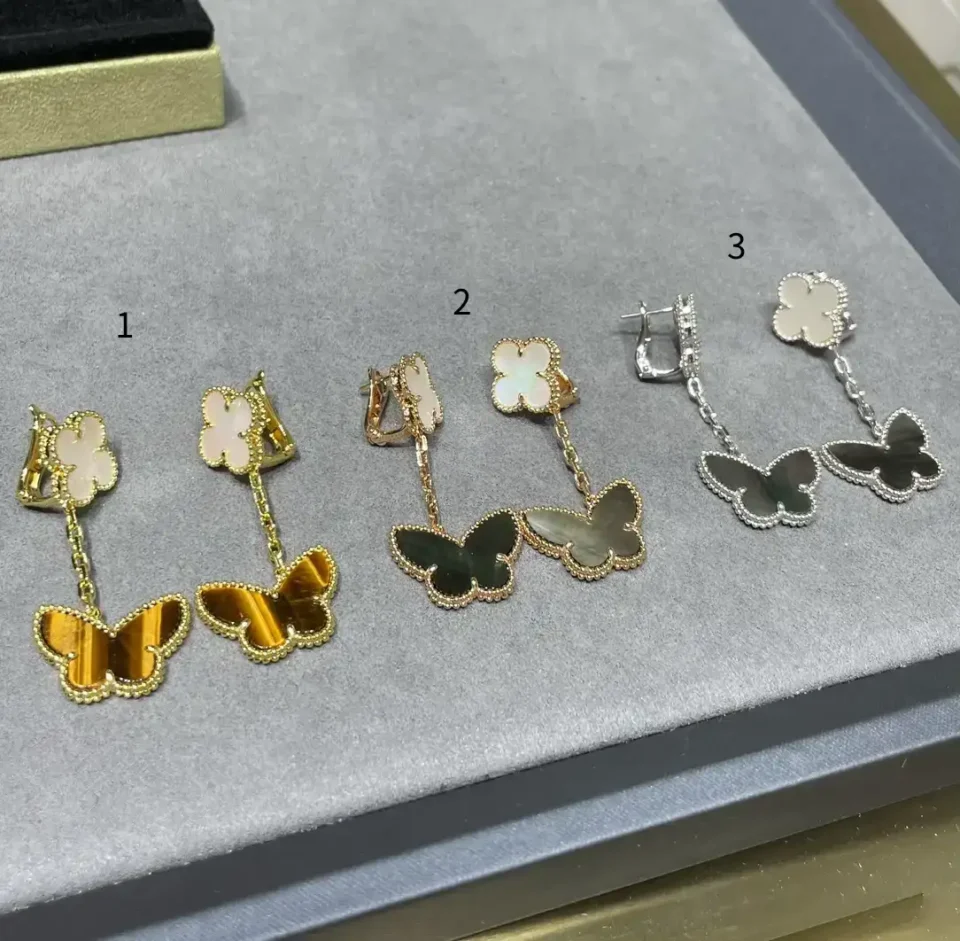 Lucky Alhambra earrings, 2 motifs 18K yellow gold, Mother-of-pearl, Tiger Eye