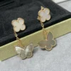 Lucky Alhambra earrings, 2 motifs 18K yellow gold, Mother-of-pearl, Tiger Eye