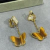 Lucky Alhambra earrings, 2 motifs 18K yellow gold, Mother-of-pearl, Tiger Eye