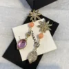 2024/25 Métiers d’art  Chanel Pendant Earrings  Metal, Natural Stones, Glass, Strass  Gold, Pink & Crystal