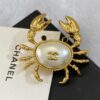 CHANEL Coco Beach 2026 collection  brooch   Metal & Glass  Gold, Pearly White & Black