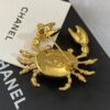 CHANEL Coco Beach 2026 collection  brooch   Metal & Glass  Gold, Pearly White & Black