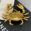 CHANEL Coco Beach 2026 collection  brooch   Metal & Glass  Gold, Pearly White & Black